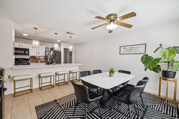 a view of a dining room with furniture