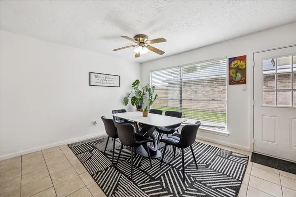 a view of a dining room with furniture window and outside view