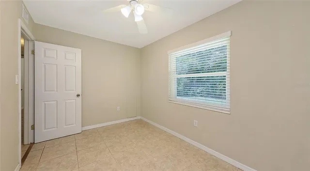 a view of an empty room with a window