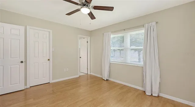 a view of an empty room with a window