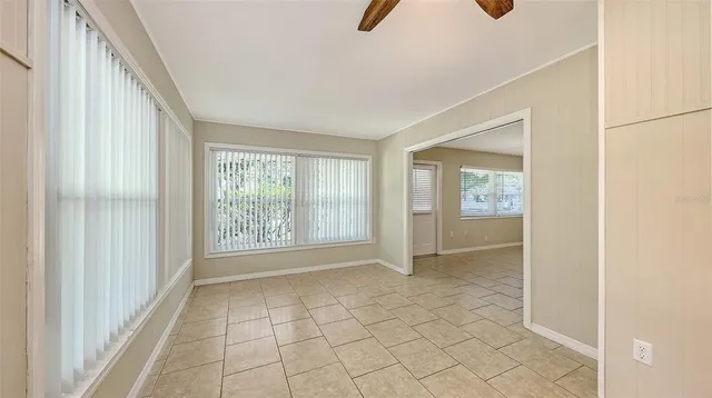 a view of an empty room with windows