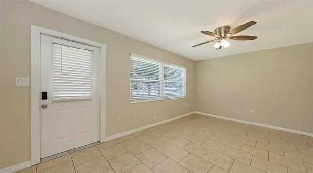 a view of an empty room with a window