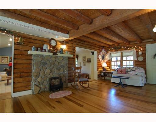 24 Elm Road Daisytown, PA 15427 - Photo 5 of 9 Living Room. Opens to den/solaium and kitchen--heated wood floors