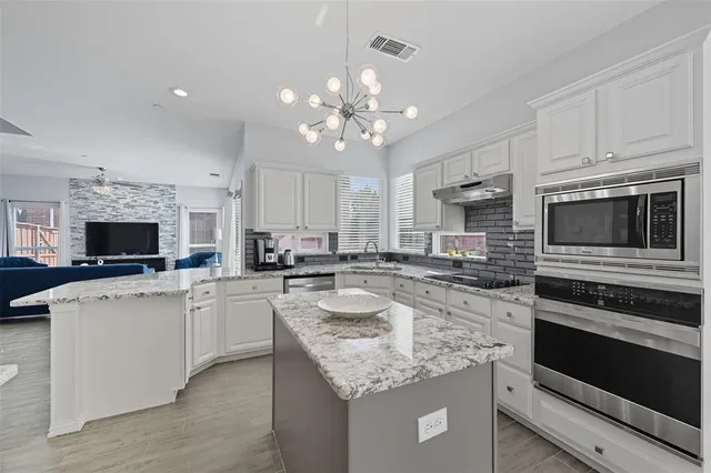 $565,000 | 14613 Woodshadow Lane, Addison, TX 75001