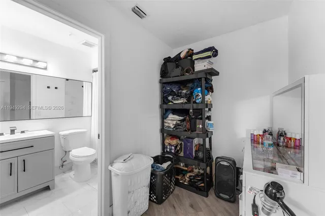 a view of bathroom with a sink and a shower