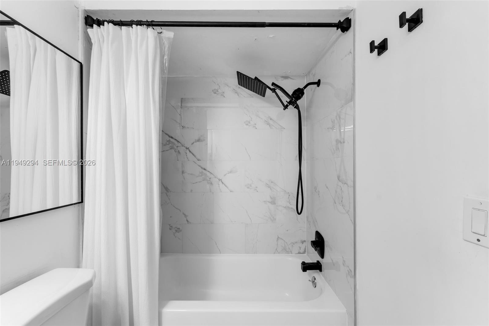 12909 Southwest 64th Lane Miami, FL 33183 - Photo 15 of 35 a bathroom with a bathtub