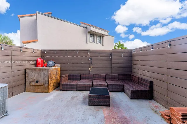 a wooden bench sitting in front of a building