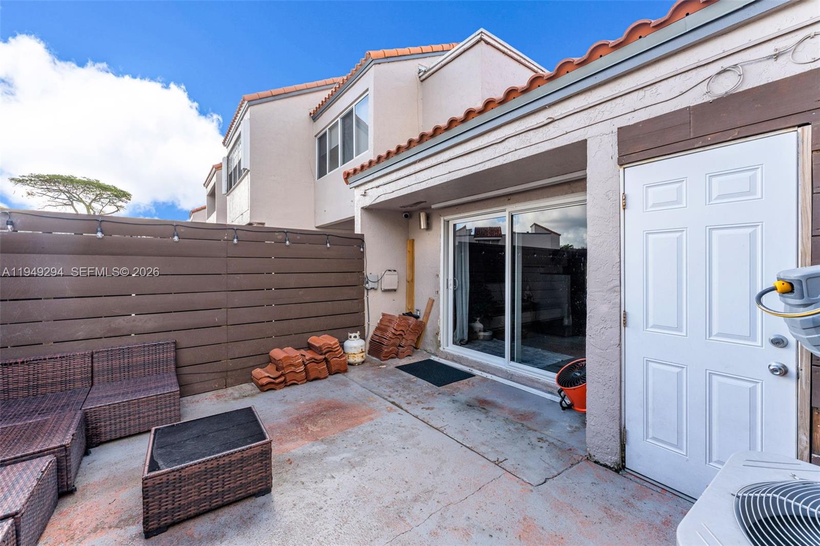 12909 Southwest 64th Lane Miami, FL 33183 - Photo 19 of 35 a front view of a house with a garage