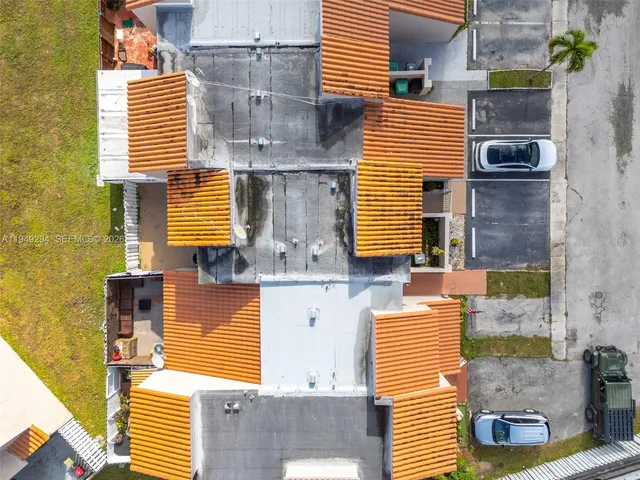 a view of front door of house with a swimming pool