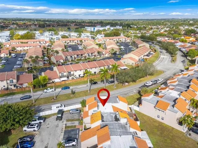 an aerial view of residential building and ocean