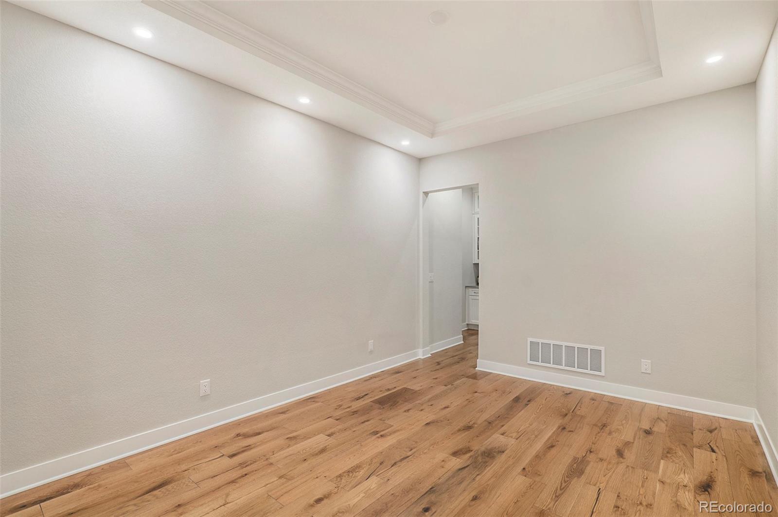5828 Tesoro Point Parker, CO 80134 - Photo 14 of 43 a view of empty room with wooden floor