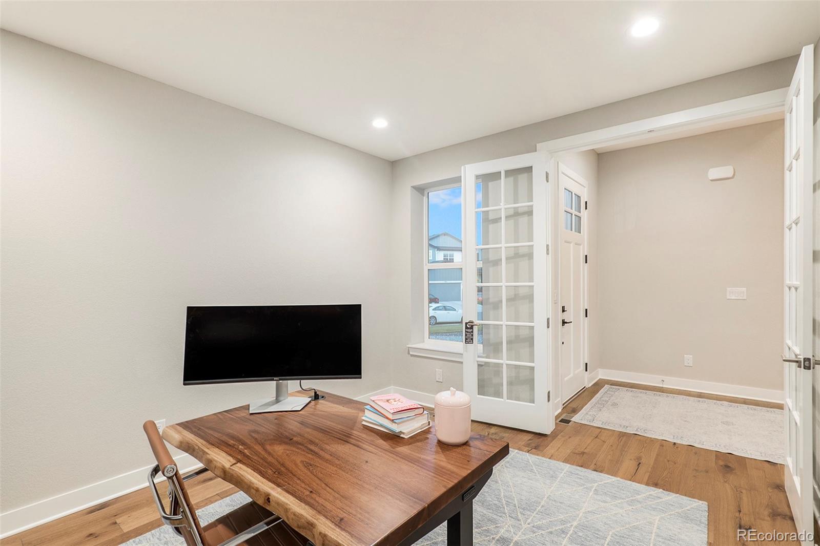 5828 Tesoro Point Parker, CO 80134 - Photo 19 of 43 a bedroom with a bed and a television