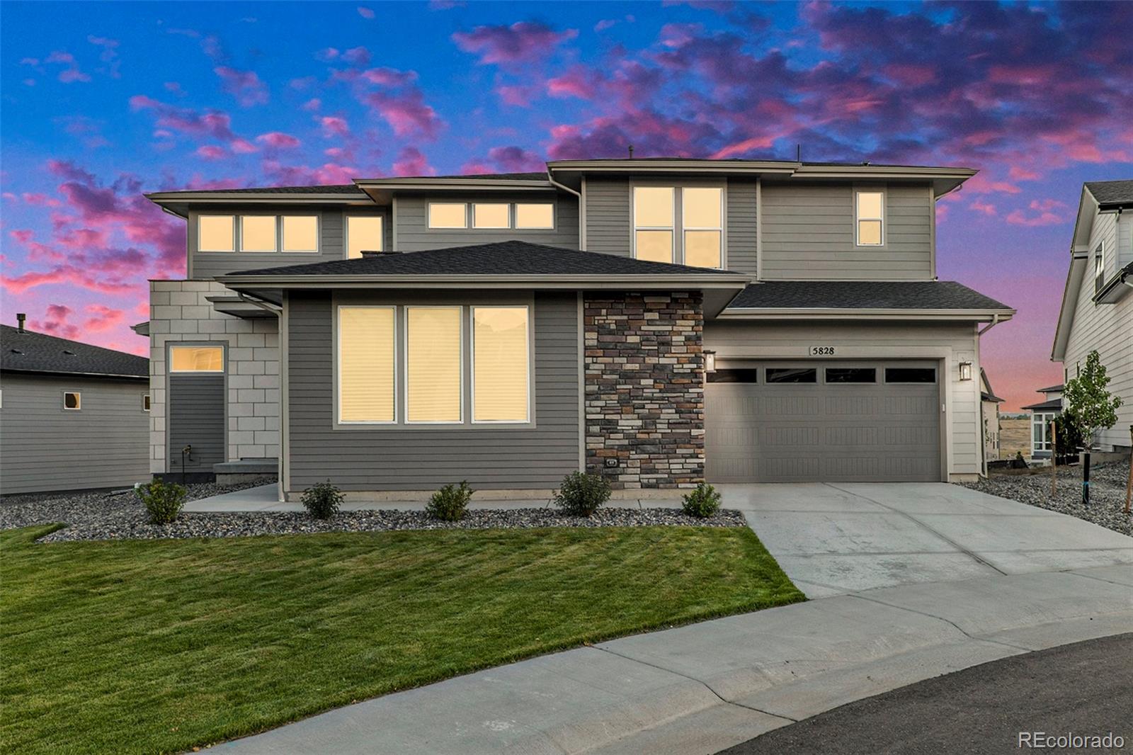 5828 Tesoro Point Parker, CO 80134 - Photo 2 of 43 a front view of a house with a yard