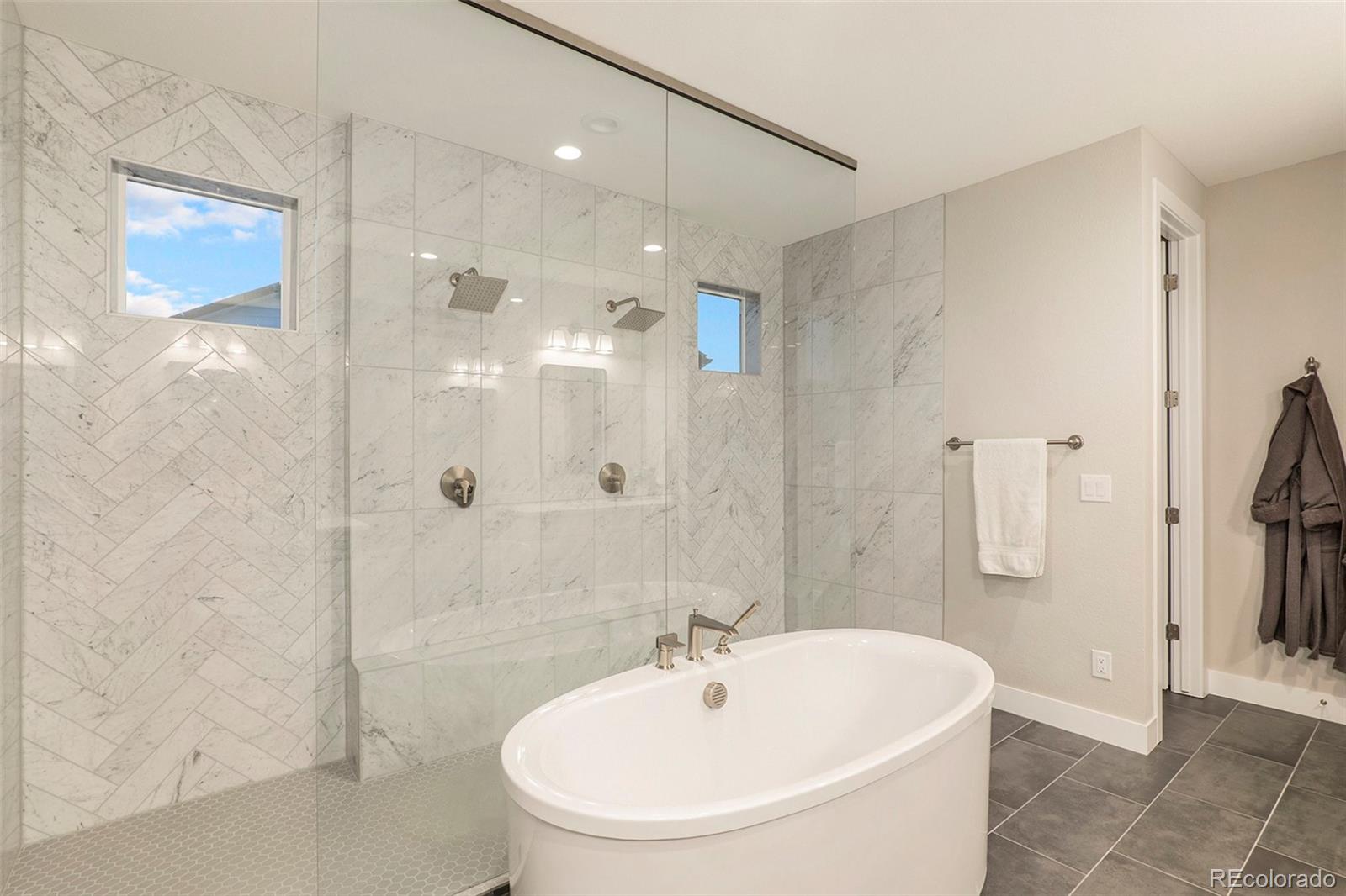 5828 Tesoro Point Parker, CO 80134 - Photo 27 of 43 a bathroom with a sink a toilet and shower