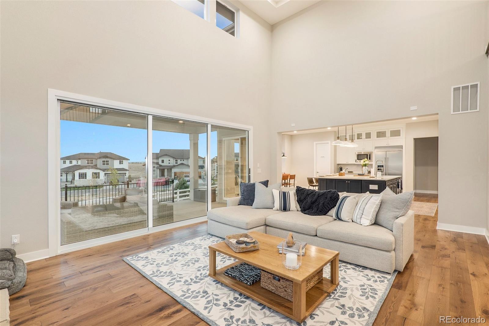 5828 Tesoro Point Parker, CO 80134 - Photo 10 of 43 a living room with furniture and wooden floor