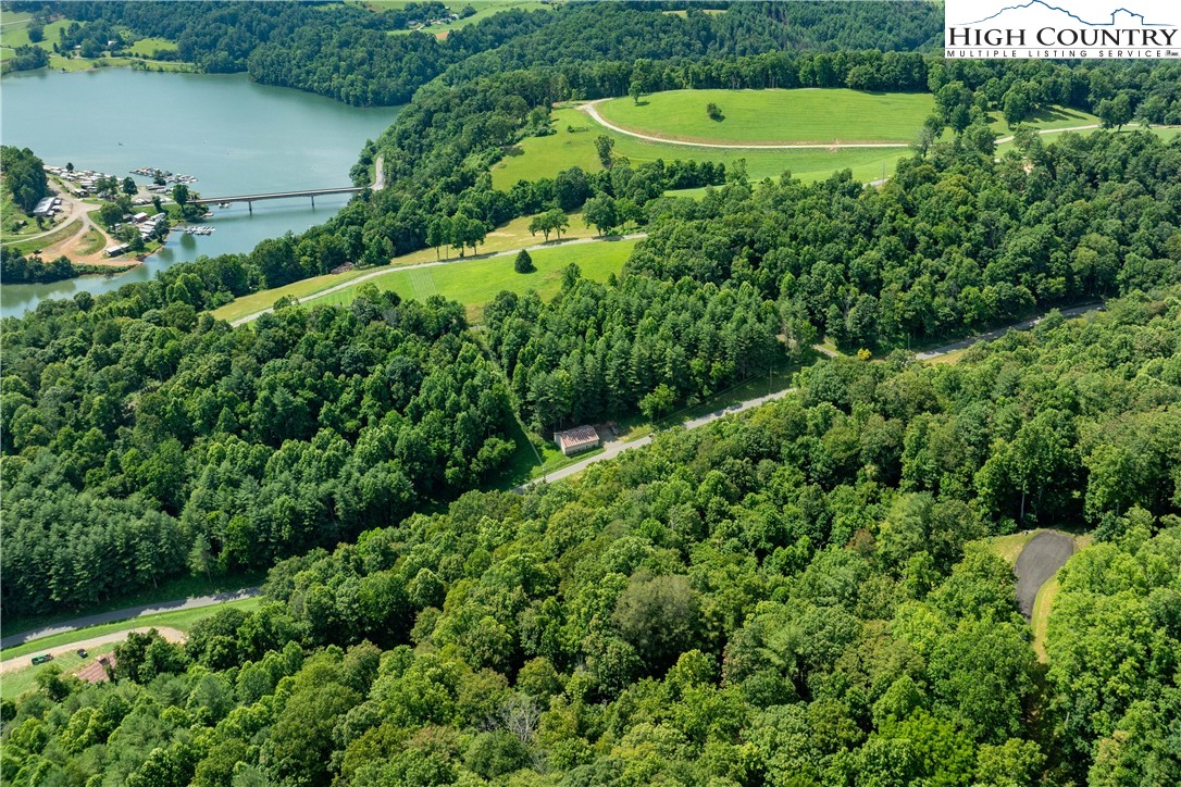 Lot 32 Lake Ridge Butler, TN 37640 - Photo 14 of 30 an aerial view of a house with a yard and lake view