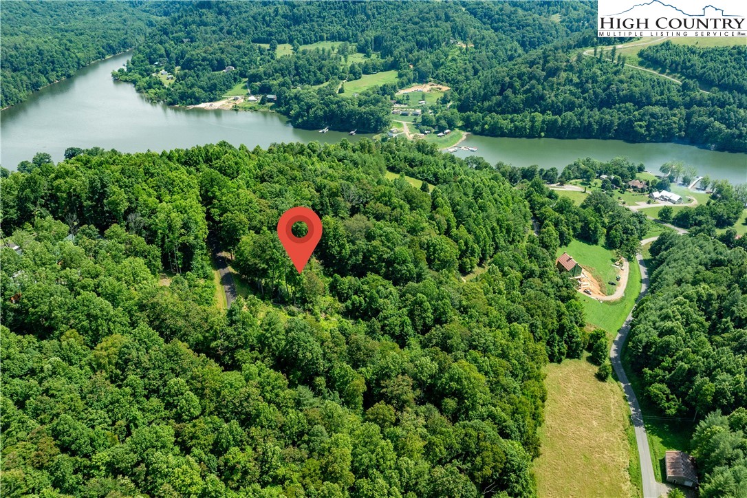 Lot 32 Lake Ridge Butler, TN 37640 - Photo 25 of 30 an aerial view of a house with a yard and lake view
