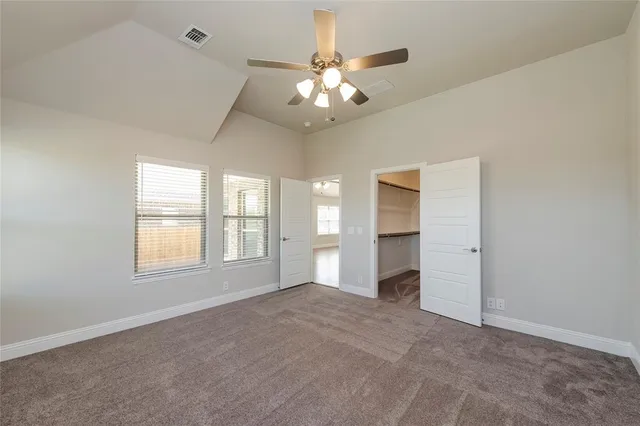 a bathroom with a granite countertop sink a large mirror and a bathtub with shower
