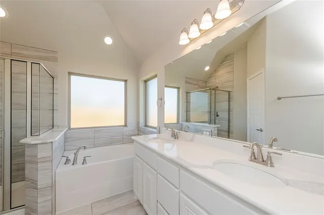 a bathroom with a bathtub and a shower