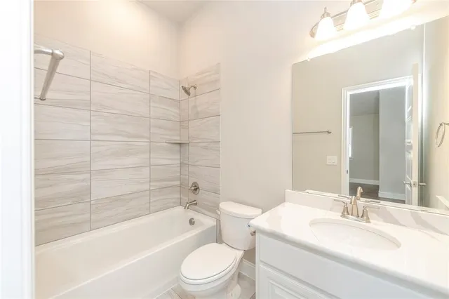 a large house with a big yard and large trees