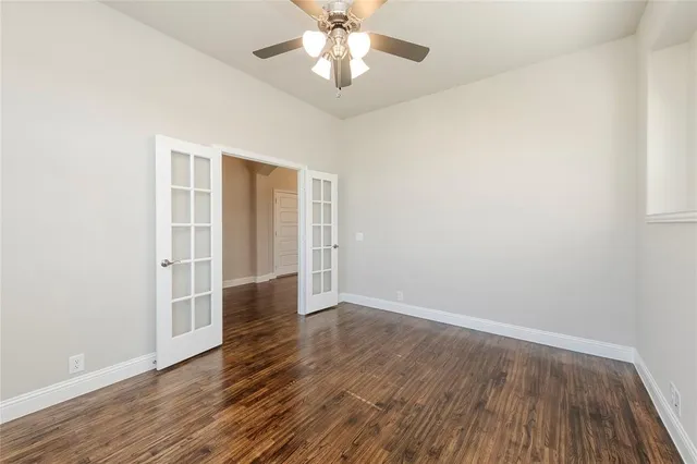 a kitchen with kitchen island a sink and a stove top oven