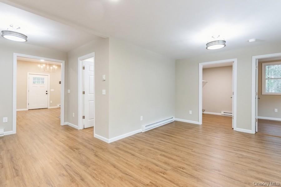 435 State Rte 55 Eldred, NY 12732 - Photo 12 of 26 wooden floor in an empty room with a window