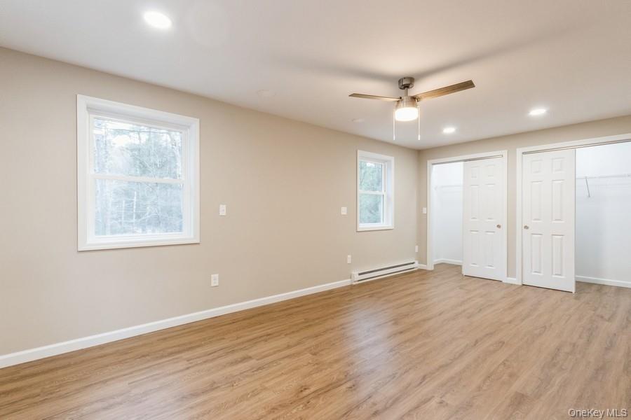 435 State Rte 55 Eldred, NY 12732 - Photo 17 of 26 a view of an empty room with wooden floor and a window