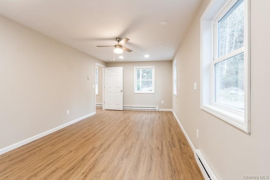 435 State Rte 55 Eldred, NY 12732 - Photo 18 of 26 wooden floor in an empty room with a window