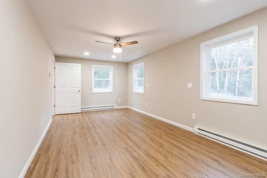 435 State Rte 55 Eldred, NY 12732 - Photo 19 of 26 wooden floor in an empty room with a window