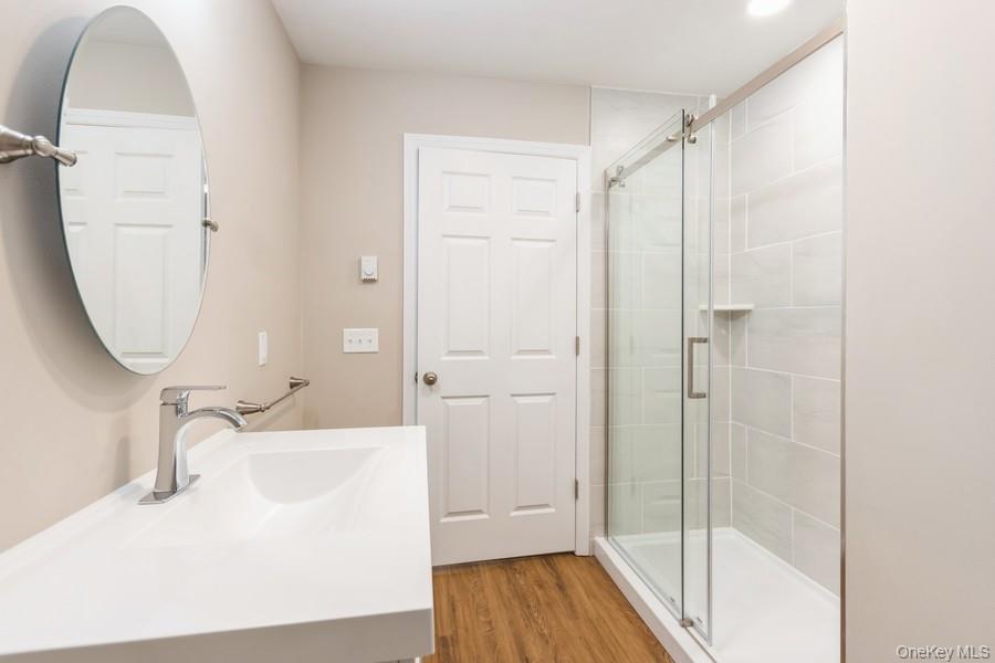 435 State Rte 55 Eldred, NY 12732 - Photo 23 of 26 a bathroom with a sink and a mirror