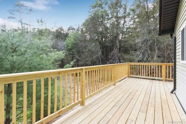a view of balcony with wooden floor