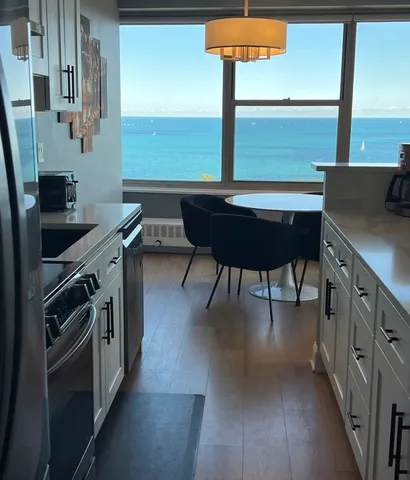 a kitchen with stainless steel appliances a sink a stove and a refrigerator