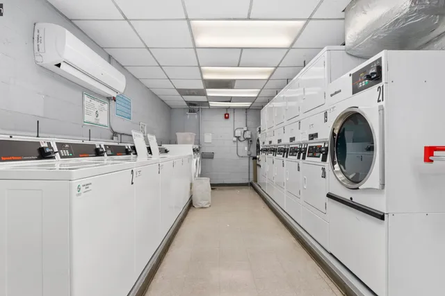 a kitchen with stainless steel appliances a sink a stove top oven a sink and cabinets