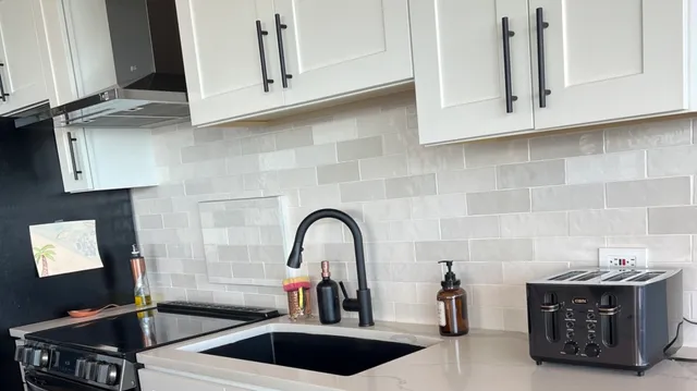 a kitchen with a sink and a stove
