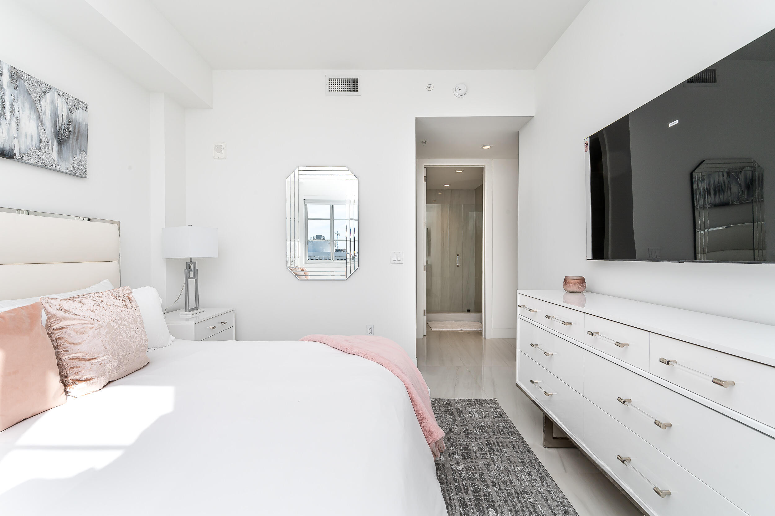 155 East Boca Raton Road, Unit 1103 Boca Raton, FL 33432 - Photo 12 of 57 a bedroom with a bed and a dresser