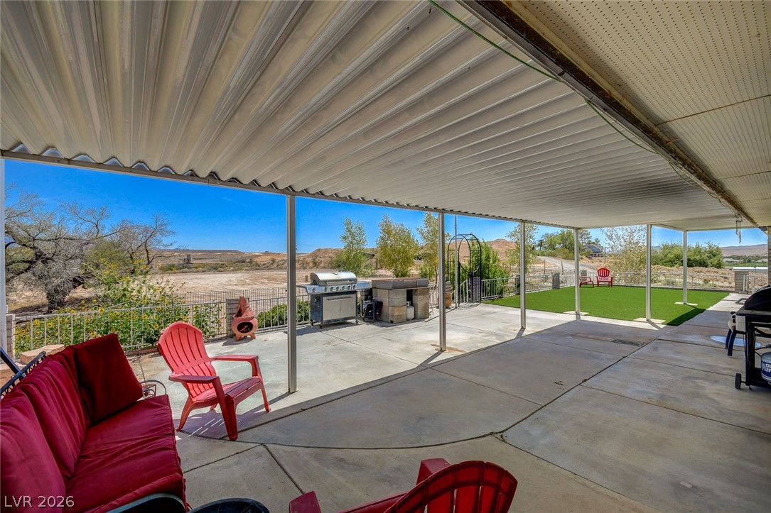 1920 Bowman Road Logandale, NV 89021 - Photo 13 of 68 An expansive covered patio provides comfortable shelter and scenic desert views.