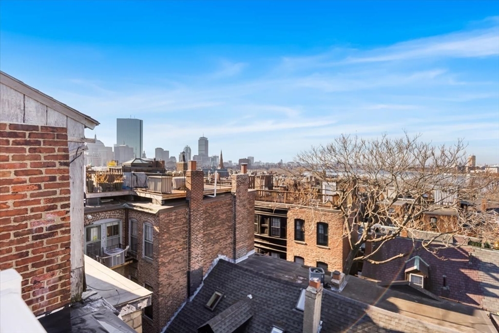 6 Goodwin Place, Unit 4 Boston, MA 02114 - Photo 20 of 24 a view of a city with tall buildings