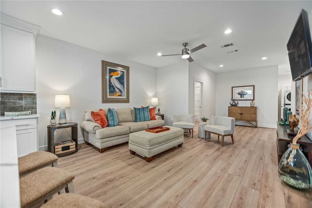 96 Circle Hook Port O'Connor, TX 77982 - Photo 11 of 36 a living room with furniture and wooden floor