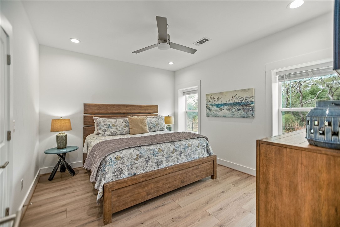 96 Circle Hook Port O'Connor, TX 77982 - Photo 16 of 36 a bedroom with a bed window and a table