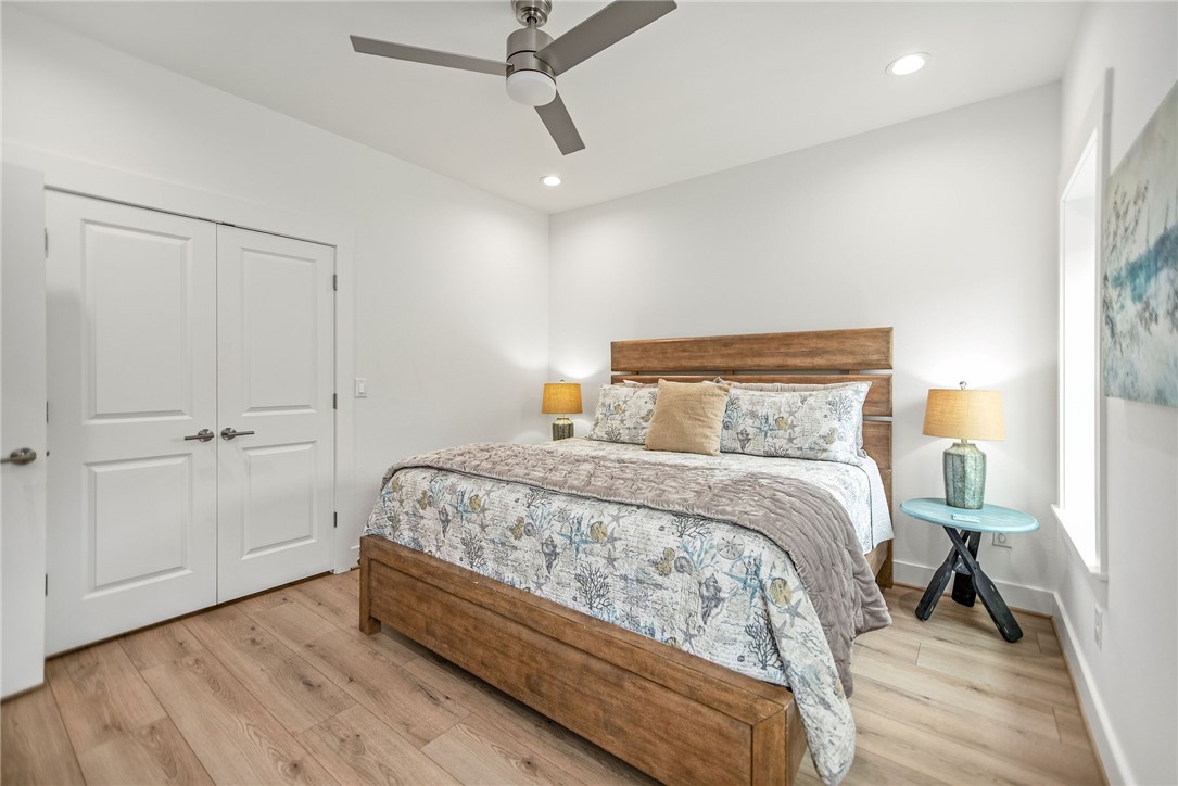 96 Circle Hook Port O'Connor, TX 77982 - Photo 18 of 36 a bedroom with a bed and a mirror