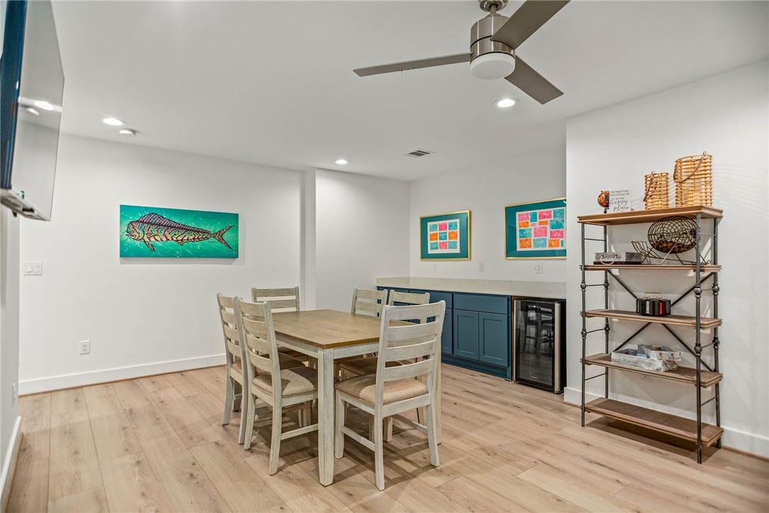 96 Circle Hook Port O'Connor, TX 77982 - Photo 25 of 36 a view of a dining room with furniture and wooden floor
