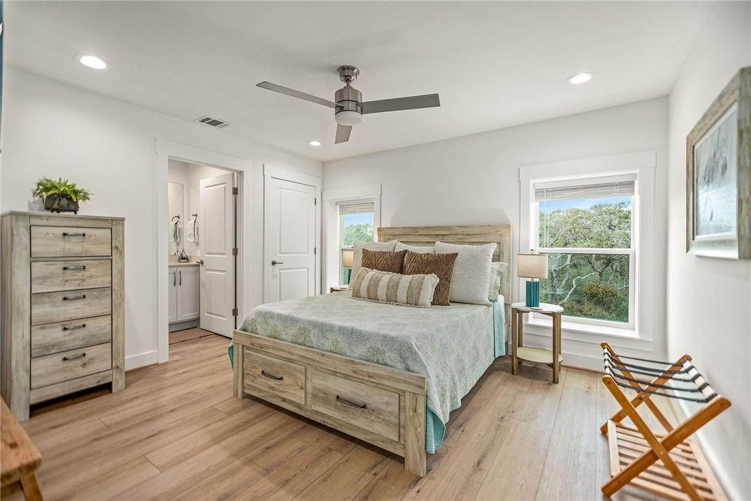 96 Circle Hook Port O'Connor, TX 77982 - Photo 27 of 36 a bedroom with a bed and a dresser