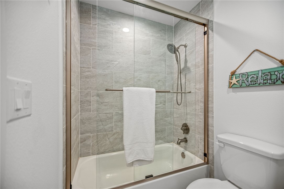 96 Circle Hook Port O'Connor, TX 77982 - Photo 30 of 36 a bathroom with a glass shower door
