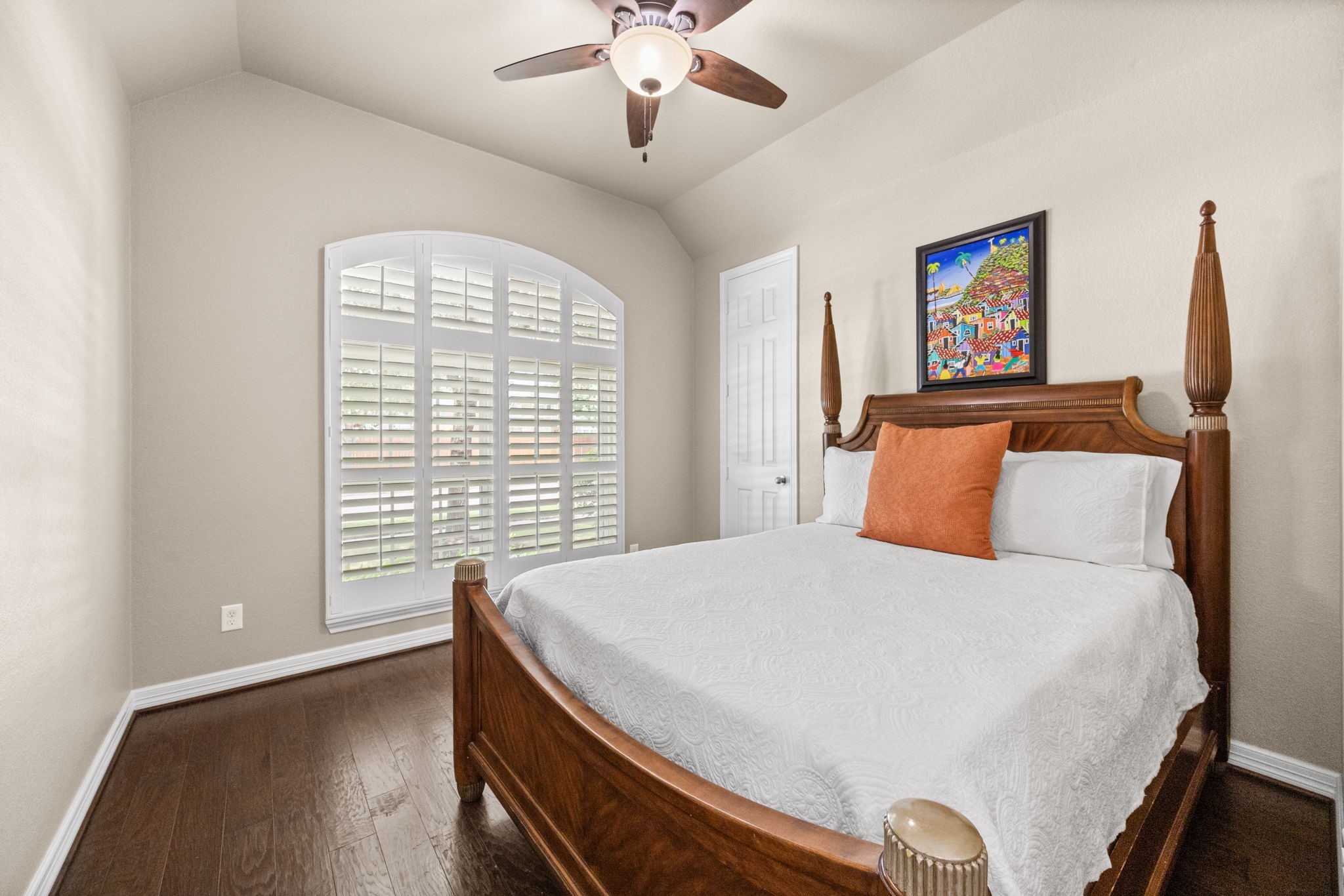 27642 Linden Ridge Lane Fulshear, TX 77441 - Photo 23 of 42 All Secondary Bedrooms are generously sized and thoughtfully appointed with wood flooring, windows with Plantation Shutters, stylish 5-blade ceiling fans, and walk-in closets, offering comfort, functionality, and ample storage for family or guests.