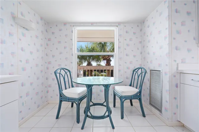 a view of a chair and table in the room