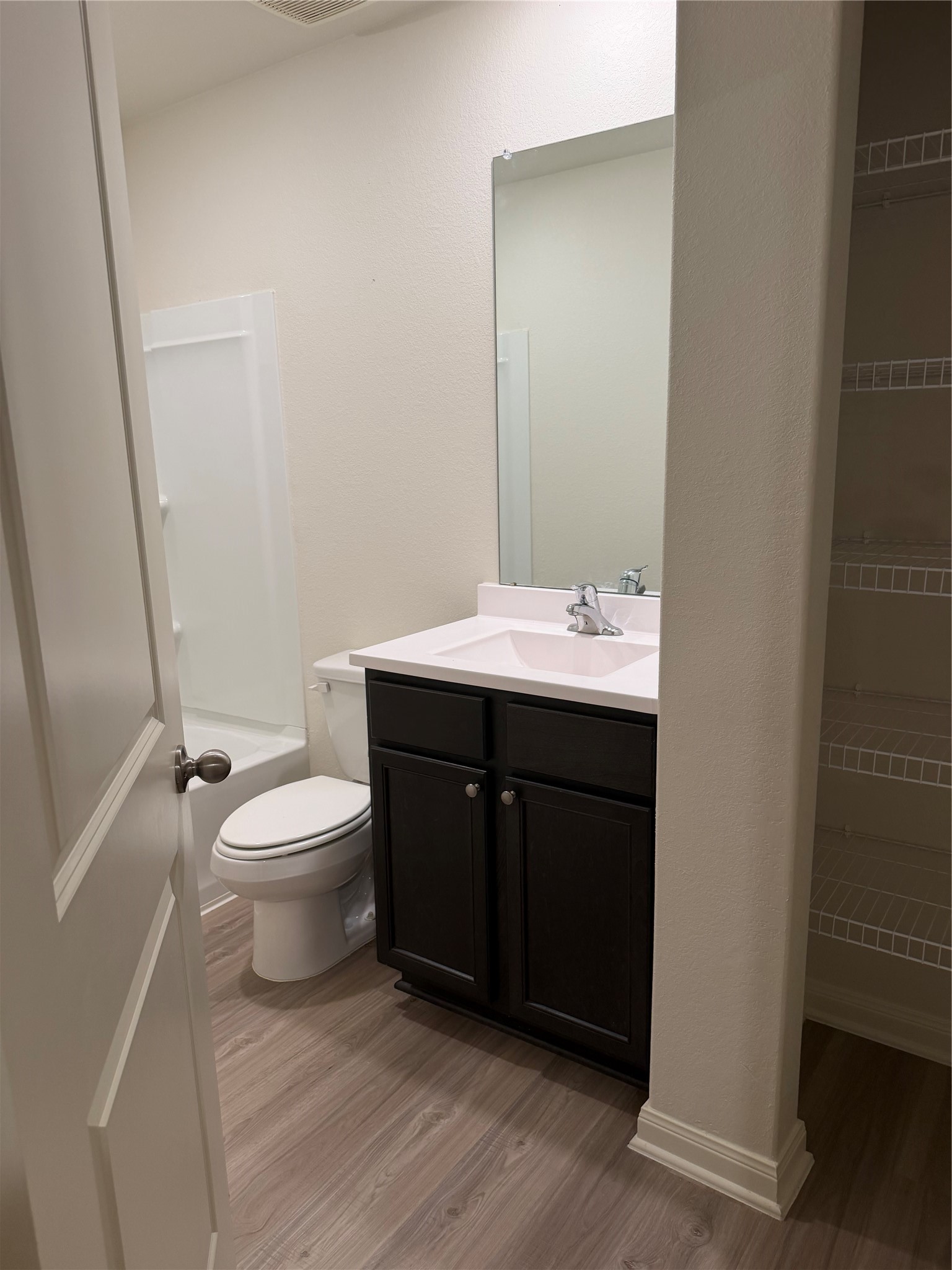 8410 Dusty Ridge Road Baytown, TX 77523 - Photo 14 of 18 a bathroom with a sink vanity mirror and toilet