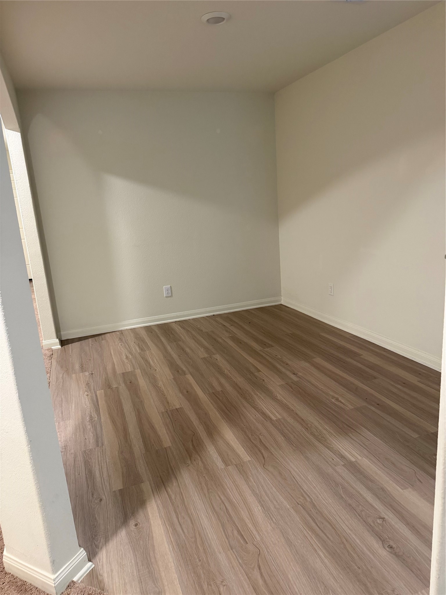 8410 Dusty Ridge Road Baytown, TX 77523 - Photo 15 of 18 a view of empty room with wooden floor