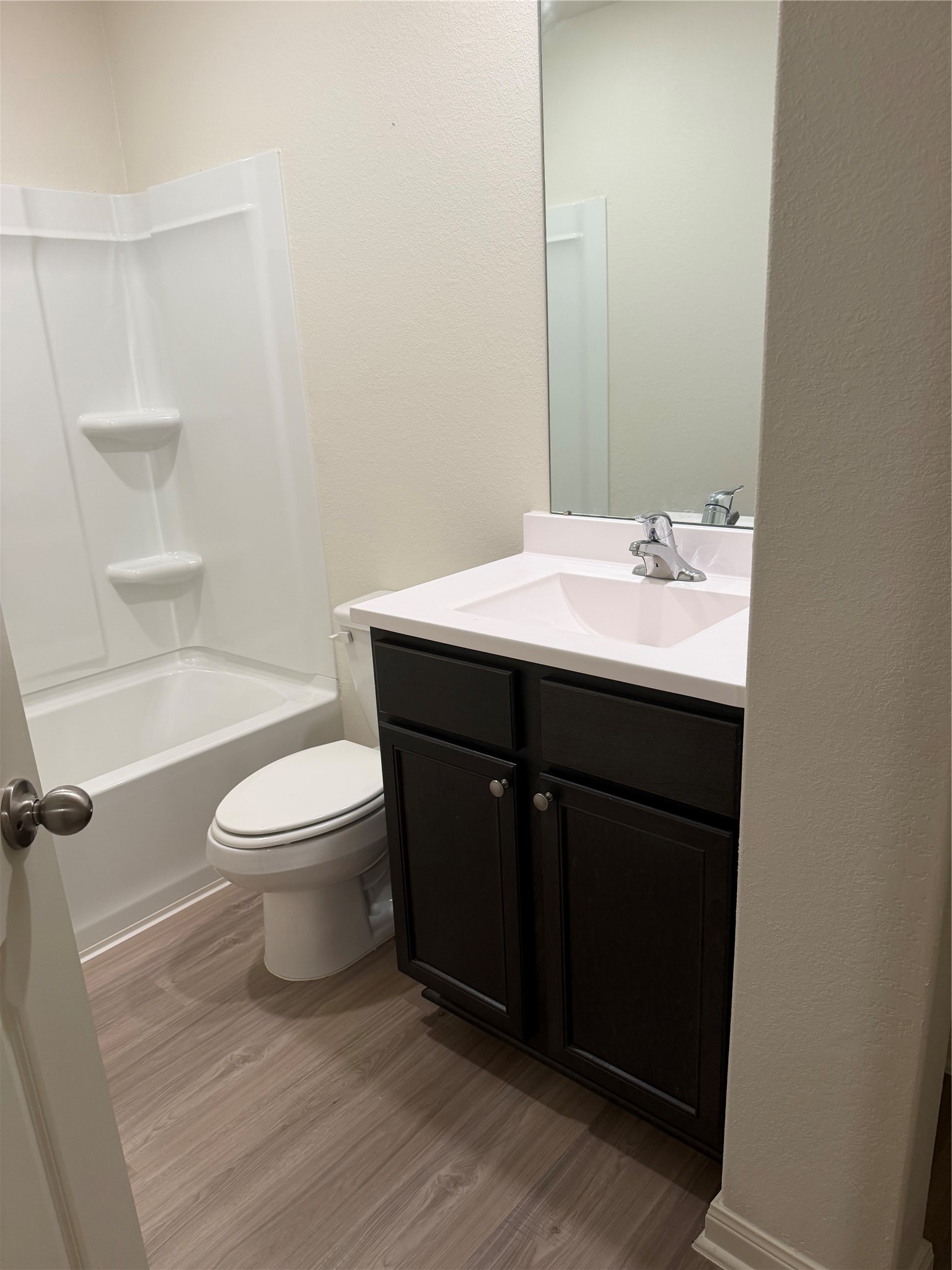 8410 Dusty Ridge Road Baytown, TX 77523 - Photo 16 of 18 a bathroom with a sink toilet and shower