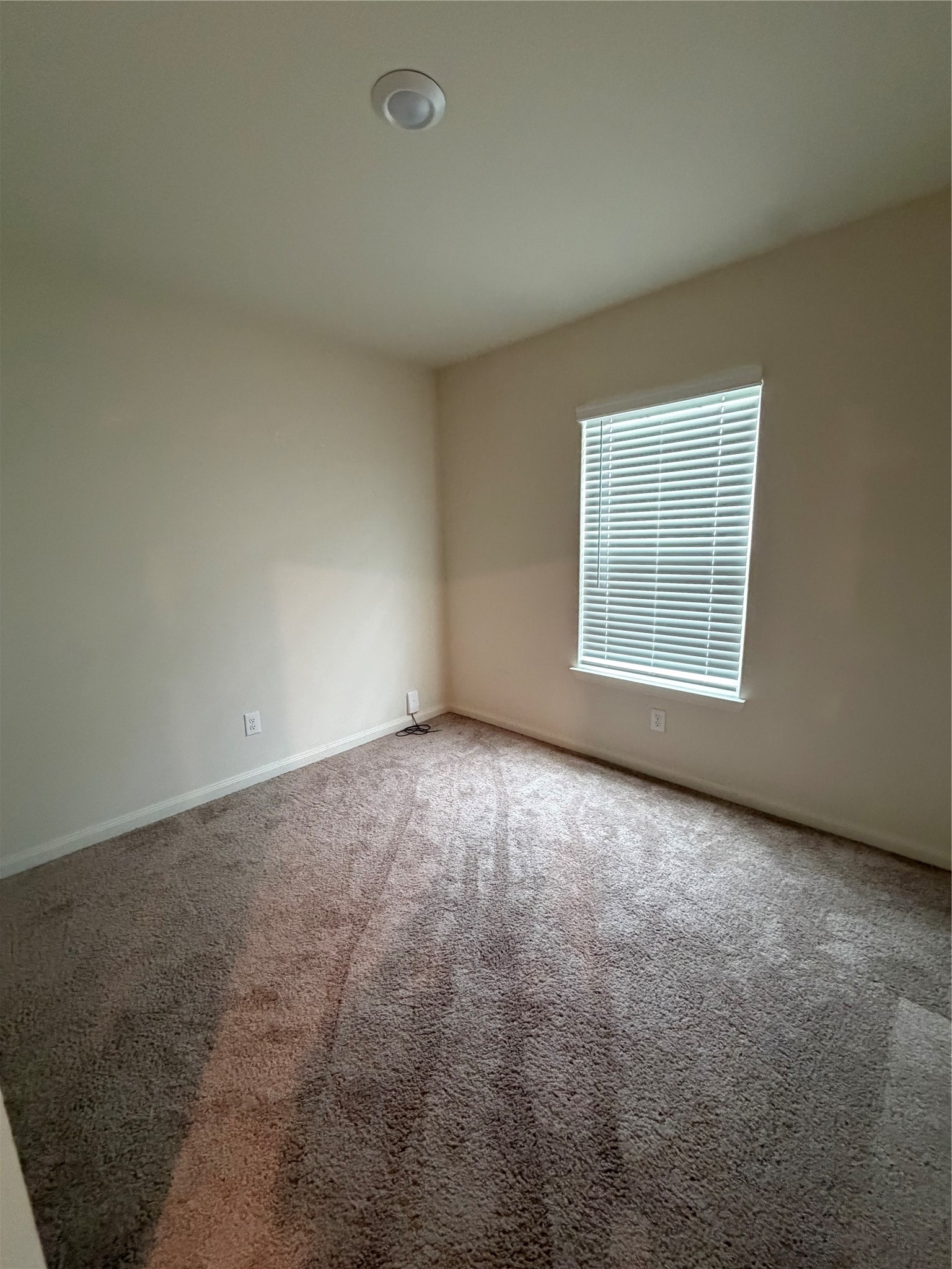 8410 Dusty Ridge Road Baytown, TX 77523 - Photo 17 of 18 an empty room with windows