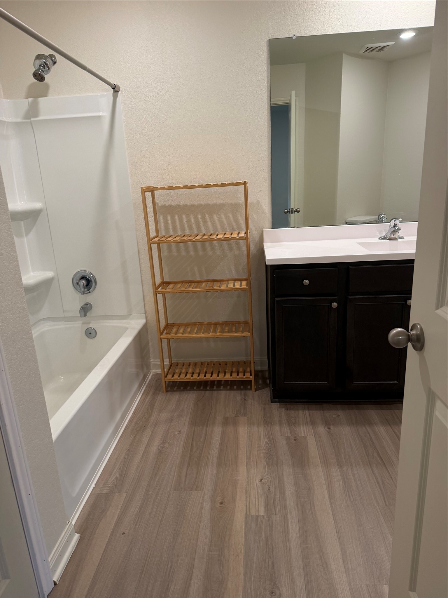 8410 Dusty Ridge Road Baytown, TX 77523 - Photo 7 of 18 a bathroom with a bathtub and a sink